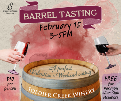 Promotional graphic for 'Barrel Tasting' at Soldier Creek Winery on February 15 from 3–5 PM. The design features a wine barrel with the text 'A perfect Valentine’s Weekend outing' written on it. Two hands are shown holding wine glasses, one with red wine spilling slightly. The background has a watercolor-style texture in pink and red tones. Text highlights that the event costs $10 per person and is free for Paragon Wine Club members. The Soldier Creek Winery logo is displayed at the top.