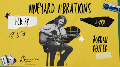 Promotional graphic for 'Vineyard Vibrations' at Soldier Creek Winery on February 28 from 6–8 PM. The design features a yellow background with a collage-style layout, including cassette tapes, a boombox, and hand-drawn elements. A central image showcases a musician sitting on a stool and playing an acoustic guitar. The band is listed as 'Jordan Reuter.' The Soldier Creek Winery logo is displayed in the bottom left corner. Jordan plays folk americana music.